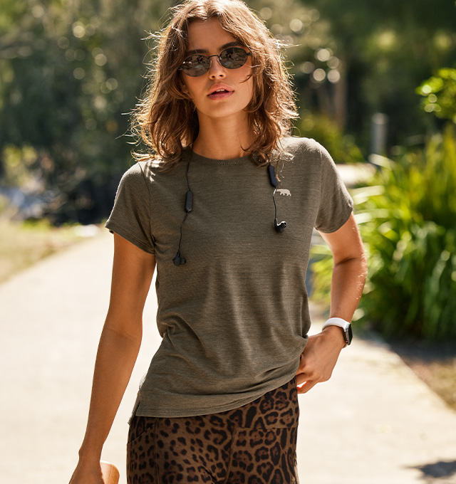 Woman wearing a Running Bare workout tee