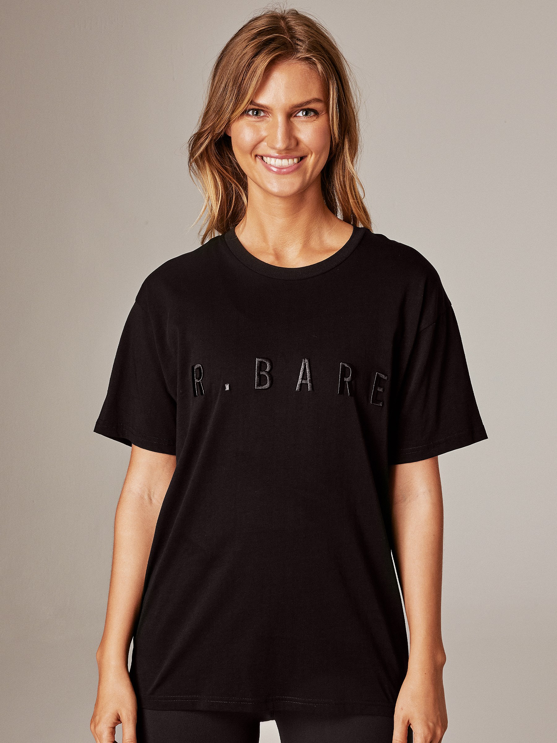 Running Bare Hollywood 90s Tee. Shop Womens Black Gym T-Shirts.